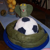 Green Cobras soccer ball made from the wilton ball pan. Green cobra is the soccer team. Made it with rice cereal covered with fondant.