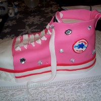 Shoe Cake Converse shoe cake is chocolate covered with Fondant. The Jewels are not ediable they are from the craft departmant. Thanks to ananmondo...