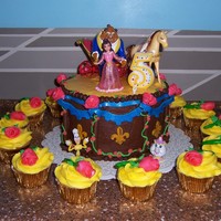 Beauty And The Beast 9" rounds covered with bc and fondant accent peices. Cup cakes are bc with fondant roses. My little girl wanted figures she could keep...