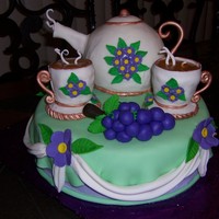 Tea Party This is mostly fondant, with a touch of butter cream. I made it for a teaparty. I attached the teapot and cups with wooden dowels. The...