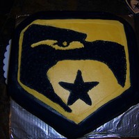 G I Joe Just a transfer on a square cake that I carved itto the sheild.