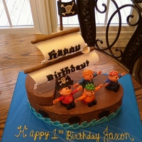 Pirate Cake Marble cake with buttercream icing and filling. The people are made from brownies and covered in fondant, the shoes as well ar fondant/...