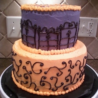 Purple And Orange Halloween Themed Birthday 8in btm vanilla filled with buttercream and 6 inch strawberry with buttercream filling. Birthday was hallowen themed.