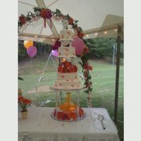 Wedding Cake Fuschia And Orange This cake is a 6 in, 8 in, 10 in, and 12 in classic white cake with buttercream filling and icing. It also has fuschia sugar daisies and...