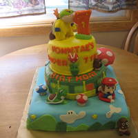 Super Marios Brothers Cake 3 layer cake - bottom is chocolate fudge with creamy peanut butter filling - middle layer is yellow with an orange cream cheese filling -...
