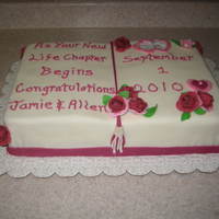 Jack & Jill Shower Cake Half chocolate - half vanilla cake filled with raspberry cream filling. Gumpaste roses and accent pieces! Congratulations to the Bride and...