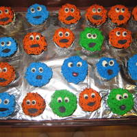 Monster Cupcakes Orange, Blue and Green monster face cupcakes. Buttercream icing with fondant eyes and mouth.Made these for a last minute fundraiser.. how...