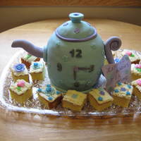 Teapot Cake Spice and vanilla cakes with orange cream cheese frosting. Covered in MMF. Handle and spout are gumpaste. Thanks to all the teapot cake...