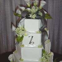 Summer Wedding This is a 5 tier wedding cake for 225 people. Starting at the bottom it was Dark Chocolate w/ dk choc ganache and peanut butter icing, Rum...