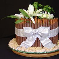 Dsc02438.jpg This was for a Tropical themed bridal shower. With Water Lilies,Orchids,and Calla Lilies.Chocolate covered pretzel rods represented the...