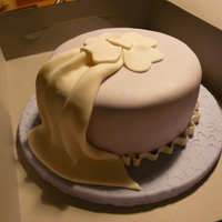 Fondant And Gumpaste Course First cake in the fondant and gumpaste course. Board and cake covered in MMF. Accents in fondant.