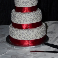 New Year's Eve Wedding Cake 3 tier wedding cake for NYE wedding. Covered in fondant with royal icing accents, painted with silver lustre dust.