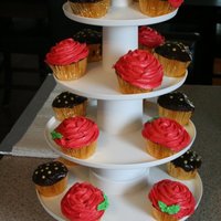 Rose And Ganache Cupcakes Chocolate cupcakes filled with chocolate hazelnut spread. Some of the cupcakes are topped with butter cream and the others were dipped in...