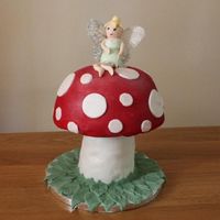 Toadstool Fairy Tinkerbell Cake All made out of vanilla cake with buttercream and strawberry filling. I didnt get the support system entirely right and had a bit of a...