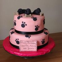Dog Themed Pink And Black Cake Bottom tier is chocolate, with chocolate fudge filling. Top tier is vanilla with strawberry filling. Models make out of sugarpaste. I...