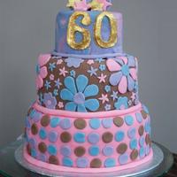 60's Themed Retro 60Th Birthday Cake Botom tier = vanilla sponge with buttercream and strawberry filling, second tier = chocolate fudge, top tier = tie-dyed vanilla sponge with...