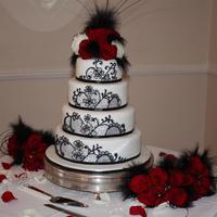 Black And White Wedding Cake Chocolate fudge, carrot and lemon, and lemon sponge. The pattern is from a photo provided by the bride and piped on with black royal icing...