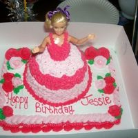 First Barbie Cake! yellow cake with buttercream icing. Used slab pan for the base and a glass bowl for the dress lol