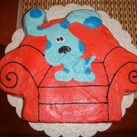 Blues Clues Blue on his big red chair.