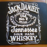 Jack Daniels Bottle Jack Daniel's bottle cake for a friend's 40th bday. Chocolate cake, buttercream filling covered in fondant. Piping is done with...