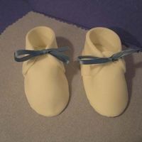 Fondant Baby Shoes My first attempt at fondant Baby Shoes. Just for practice, hope to get to make them for a cake someday soon.