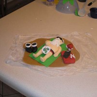 Santa On The Beach - Censored My first Gumpaste figure, Santa relaxing on the beach, he will have a margarita in hand and a palm tree when finished. I think he turned...