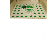 Froggies Baby shower cake for a young mother who loves Frogs. Hand piped, first time making frogs.