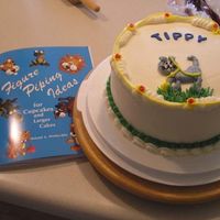 Cat Figure Piped/flavor Practice Cake My son got me Rolund Winebecklers book on figure piping, I was experimenting with flavors for his wedding cake and had left over colored...