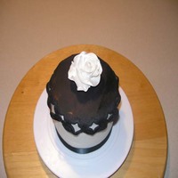 6" Sample Cake W/ Gumpaste Rose 6" Choc Fudge/WASC Layers with Raspberry filling, Butter Cream, fondant drape, Gum Paste Rose sprayed with Pearl Luster Spray, black...