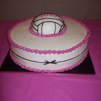 Volleyball This is a 14" half white, half chocolate cake with a half ball chocolate cake on top with Indydebi's BC and a gross grain ribbon...