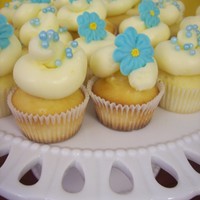 Blue Floral Mini Cupcakes These were on the dessert table at my sister's bridal shower. Mini lemon cupcakes with lemon curd filling and lemon IMBC. Royal icing...