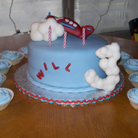 Airplane Birthday This is my son's birthday cake this year. He even helped with the airplane and clouds. It is a 9" round chocolate cake with creme...