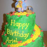 Follow The Yellow Brick Road Three tier cake, that was later cut into a spiral that went all the way around to the top. Butter cream Frosting, Doroty Doll and Toto in...