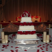 3 Tier Wedding Cake banana, chocolate, and strawberry cake with buttercream frosting, cornelli lace