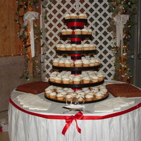 Cupcake Tower-Wedding 130 white cupcakes with strawberry filling and buttercream frosting2 all chocolate 1/4 sheet cakes