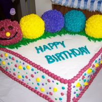 Catepillar 1St Birthday Cake The base of this cake is a 12 inch double layer chocolate cake with a cream filling. The catepillar is a french vanilla cake with just a...