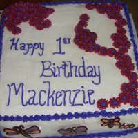 Birthday Cake With Chocolate Decorations This is a 12 inch double layer french vanilla cake with a strawberry filling. The butterflies, dragonflies, and catepillars on the side...