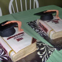 Grad Hat And Book Cake This is 2 graduation cakes I just finished my my nephew and my best friends son. I made a stencil out of cardstock to airbrush the letters...