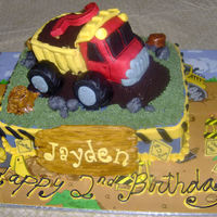 Dumptruck Cake Cake like my last one but this one has a dumptruck on top instead of tractor, marble cake with buttercream filling, truck is made of rice...