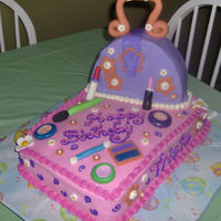 Make-Up And Purse Cake Birthday cake I just finished for a 7 year old. Marble cake with buttercream filling covered with buttercream and fondant accents. Purse is...