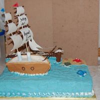 Setting Sail To College Grad Cake Yellow cake with buttercream. Fondant animals and chocolate accents.