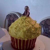 Cupcake.jpg I made this for my Godson's 1st Birthday. This was made with Wilton's giant cupcake pan cake is marble. frosting is buttercream...