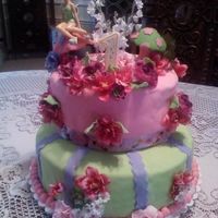 Tinkerbell This was my 1st fondant cake outside of the Wilton class. Mushrooms were gum paste & brightly colored flowers were from Michaels just...