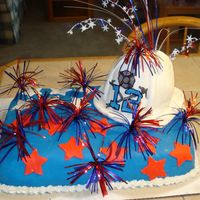 Firefighter 4Th Of July Party Bottom Cake: Lemon cake with raspberry filling with buttercream icing and MMF.Fire helmet: Classic butter cake recipe with buttercream...