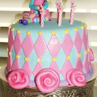 Princess Cake This was my second fondant cake, made for my nieces birthday. It was made to match the party decor.