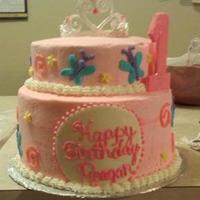 Birthday Princess First official cake order. Designed to match party invitations and decor for 1st Birthday Princess. Bottom tier Triple chocolate cake with...