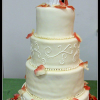 White Round Wedding Cake My first wedding cake. 6, 8, 10, 12" All White Almond Sour Cream Cake with alternating tiers of lemon filling and white chocolate/...