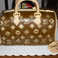 Loius Vuitton Purse This is the first purse cake I attempted. It is two 12 inch square cakes cut in half and stacked like a wedding cake. I carved it into the...