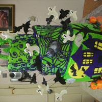 3 Tier Halloween Cake I made this cake for two 13 year old girls who share a birthday. It has gumpaste ghosts, pumpkins, bats, and the witch on top is also...