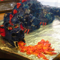 Dragon Cake The head is molded from fondant . The rest of the body is cake. I used 3 8' round cakes, I cut one in half, stacked the halves and...